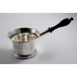 A GEORGE II BRANDY SAUCE PAN with an everting rim & a turned wooden handle, crested, by Richard