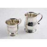 A BALUSTER MUG with a scroll handle by Ollivant & Botsford, London 1922 and a smaller mug with two