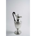 A GEORGE III VASE-SHAPED HOT WATER JUG OR EWER in the form of a vase with reeded borders, bright-cut