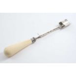 A VICTORIAN STILTON SCOOP with "pusher" & an ivory baluster handle, by George Unite, Birmingham