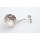 A LATE 19TH / EARLY 20TH CENTURY DUTCH CADDY SPOON with a shell bowl & the figure of cupid firing