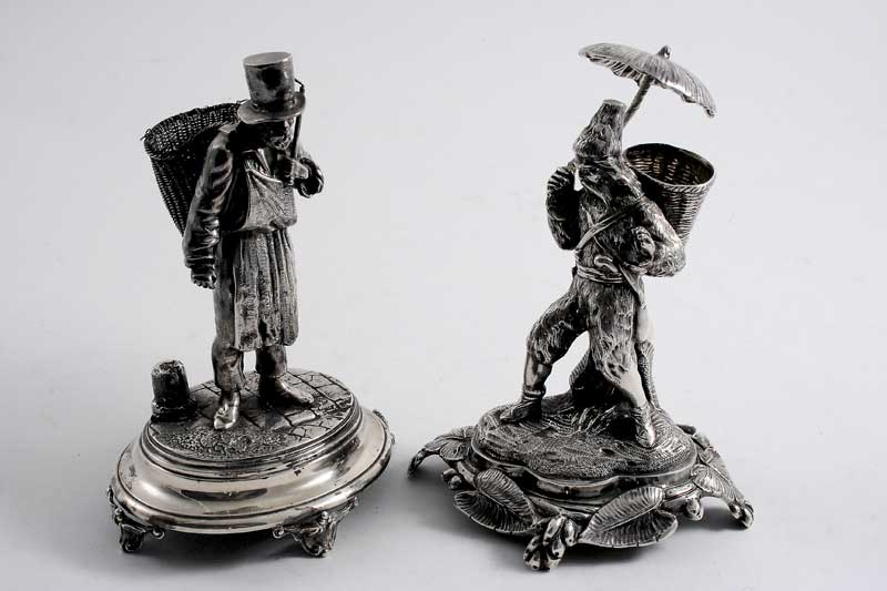 TWO 19TH CENTURY CONTINENTAL FIGURES (possibly toothpick holders); one in the form of a street