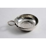 A FRENCH WINE TASTER with a coin-inset base & serpent ring handle & a name inscribed around the rim,