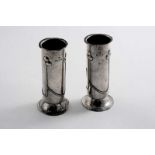 BY A.E. JONES: A pair of small Edwardian vases on flaring circular bases, Birmingham 1902 with