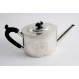 A GEORGE III ENGRAVED OVAL TEA POT with a slightly domed cover & a straight spout, crested, by