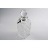 AN EDWARDIAN MOUNTED CUT GLASS "BETJEMANN'S PATENT" DECANTER & STOPPER with lock & key to secure