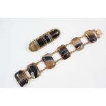 A BANDED AGATE BRACELET formed as six rectangular sections of agate, in gold, with concealed