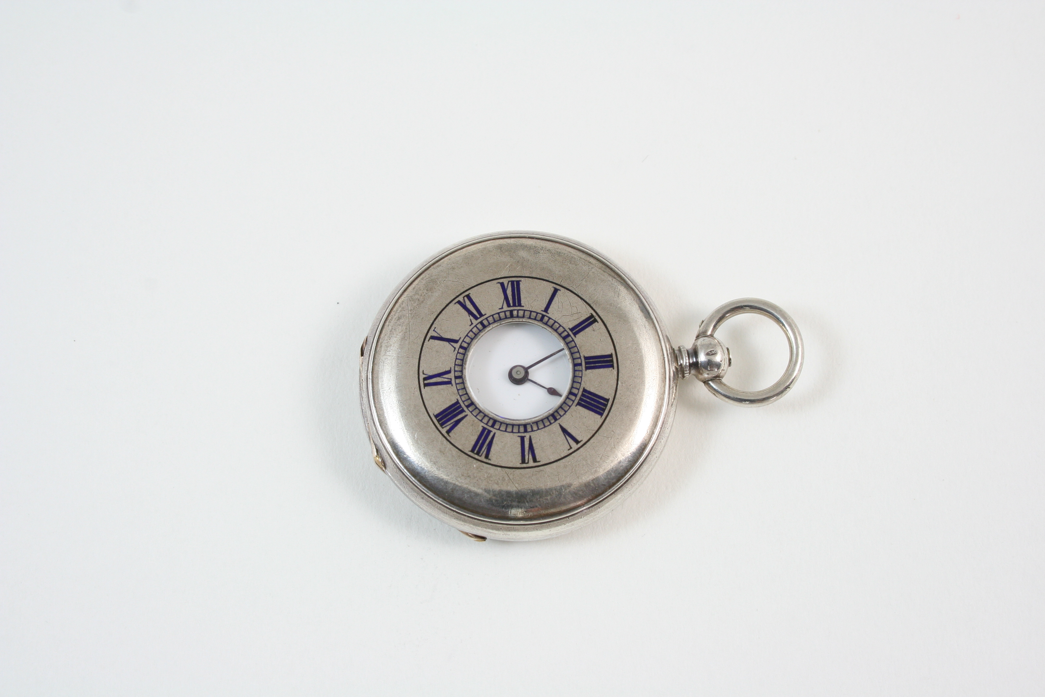 A SILVER HALF HUNTING CASED POCKET WATCH the white enamel dial with Roman numerals, cylinder,