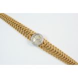 A LADY'S 18CT. GOLD AND DIAMOND WRISTWATCH BY CARTIER the signed circular dial with Arabic