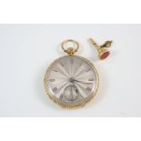 AN 18CT. GOLD OPEN FACED POCKET WATCH the silvered dial with Roman numerals and subsidiary seconds