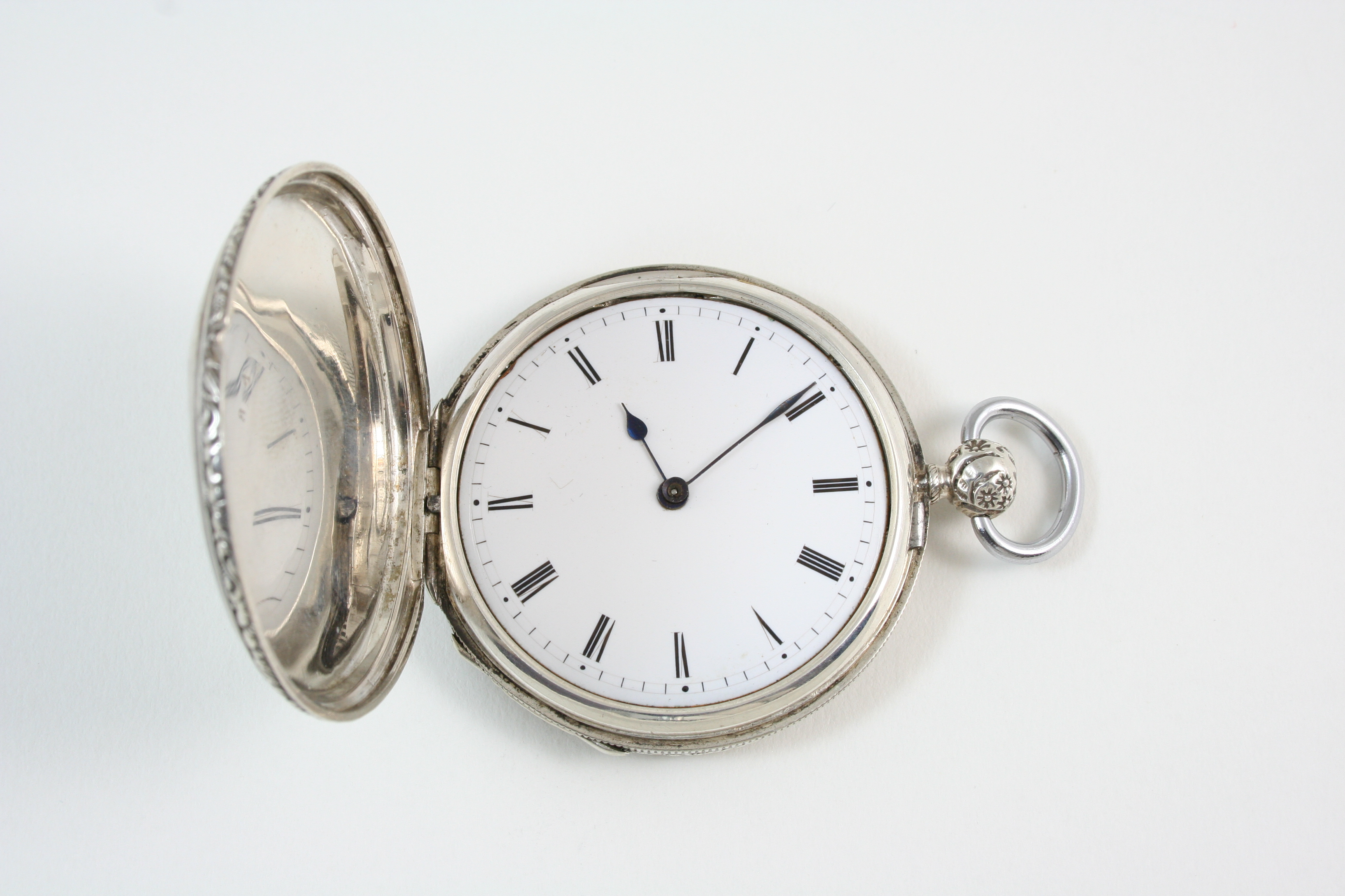 A SILVER FULL HUNTING CASED POCKET WATCH the white enamel dial with Roman numerals, the gilt metal