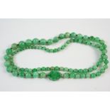 A SINGLE ROW GRADUATED JADE BEAD NECKLACE the jade beads graduate from approximately 4.7mm. to 9.