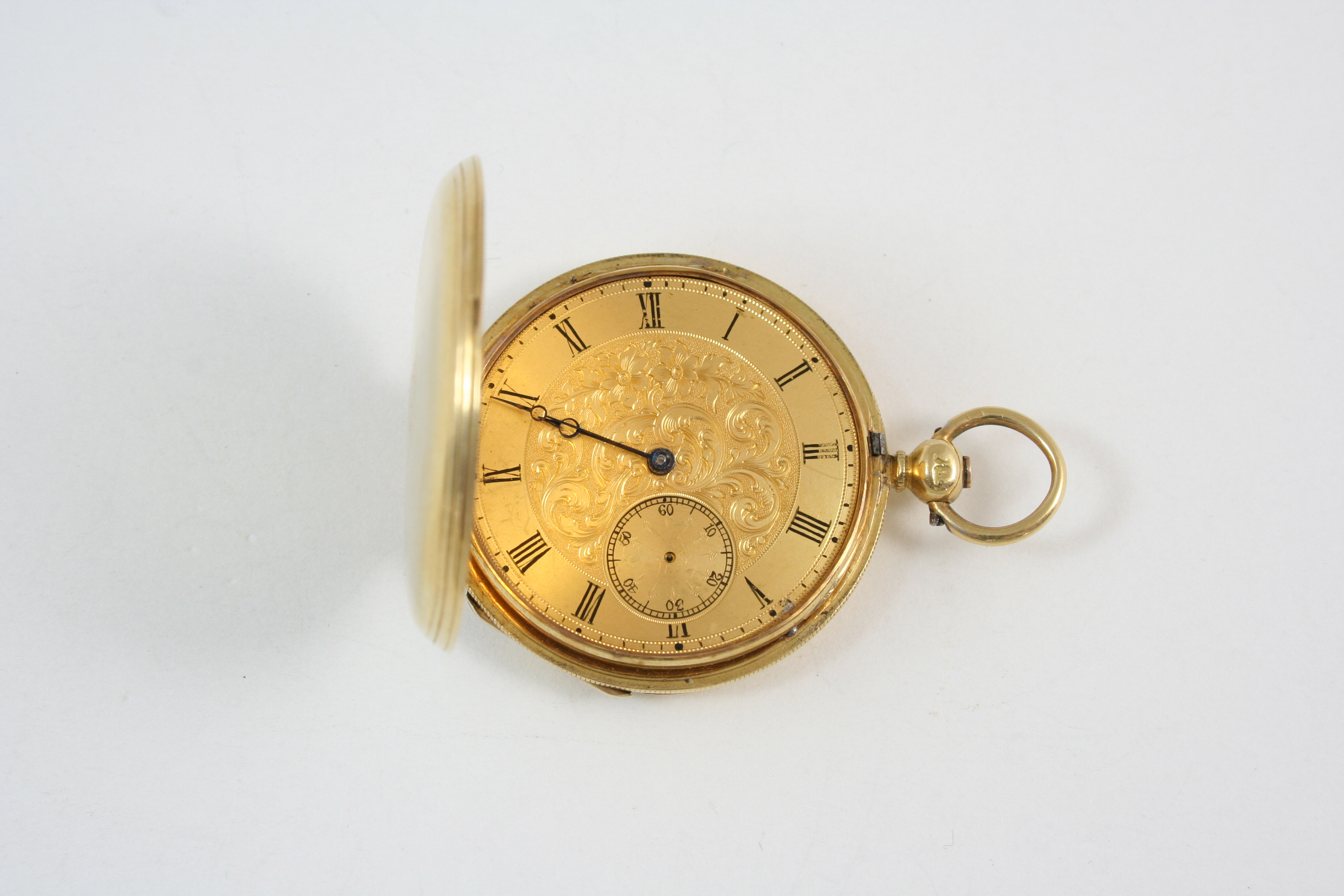 AN 18CT. GOLD FULL HUNTING CASED POCKET WATCH the gold foliate dial with Roman numerals and