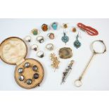 A BROWN LEATHER JEWELLERY BOX containing various items of jewellery, including, a cased set of