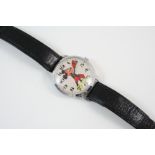 A METAL MICKEY MOUSE WATCH the circular dial with Arabic numerals, on a black leather strap.