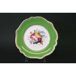 CHAMBERLAIN WORCESTER PLATE the centre painted with a panel of flowers, with a green ground and