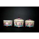 PEARLWARE BOUGH POTS a set of three early 19thc Bough pots (two with lids), brightly painted with