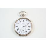 A SILVER OPEN FACED POCKET WATCH the white enamel dial signed Intact, with Roman numerals and