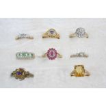 EIGHT ASSORTED GOLD AND GEM SET RINGS including a diamond three stone ring, set in gold, a solitaire