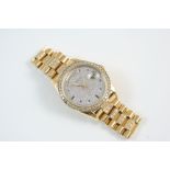 A GENTLEMAN'S 18CT. GOLD AND DIAMOND AUTOMATIC DAY DATE WRISTWATCH BY ROLEX the signed dial with
