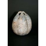 ALAN WALLWORK a pottery seed pod with vertical lines on the body. Incised mark, AW. 4 1/2ins (11.