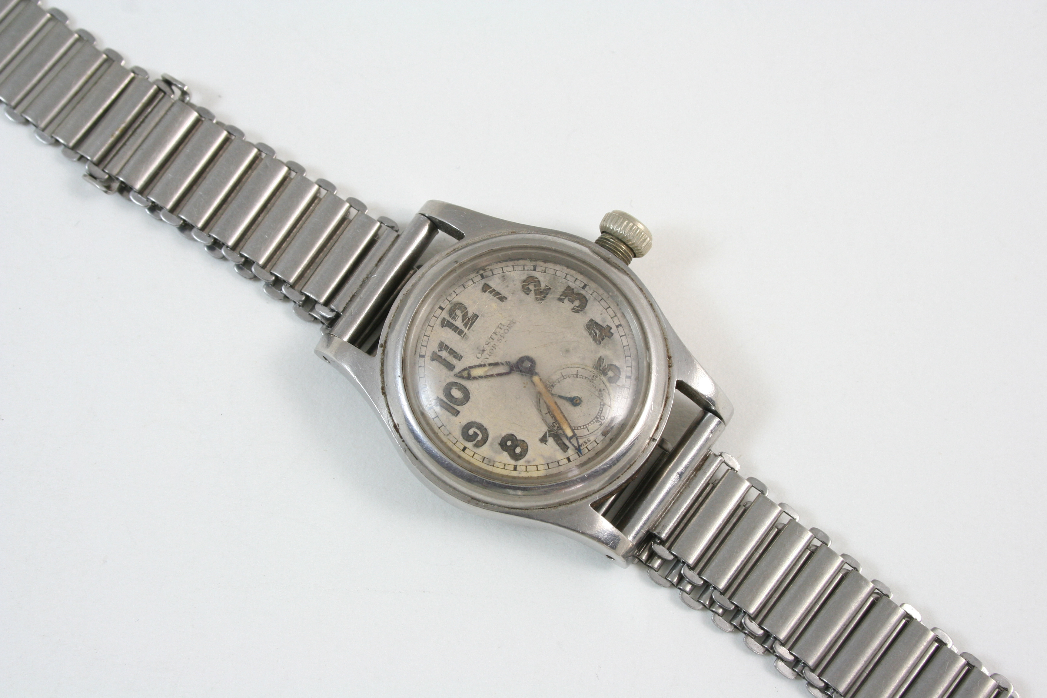 A STAINLESS STEEL OYSTER JUNIOR SPORT MECHANICAL WRISTWATCH BY ROLEX the signed circular dial with