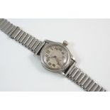 A STAINLESS STEEL OYSTER JUNIOR SPORT MECHANICAL WRISTWATCH BY ROLEX the signed circular dial with
