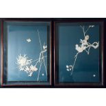 A PAIR OF JAPANESE FRAMED PICTURES of a chrysanthemum and prunus spray carved in bone and ivory on a