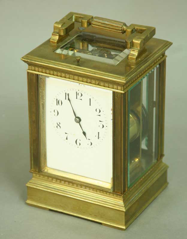 A CARRIAGE CLOCK with platform escapement and enamel dial, the movement chiming and repeating the