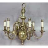A BRASS CHANDELIER of Dutch type with six scrolling branches