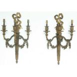 A PAIR OF ORMOLU WALL LIGHTS of Louis XVI design in the form of a quiver of arrows with floral swags