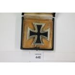 AN IRON CROSS. A cased 1st Class Iron Cross with pinback reverse, number 24 makers mark.