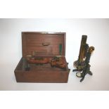 CASED MICROSCOPE - J SWIFT & SON a brass and metal monocular microscope, with a variety of lenses