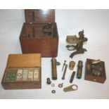 CASED MICROSCOPE & SLIDES a brass monocular microscope with a variety of lenses and accessories, and