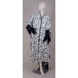AN OUTFIT FROM 102 DALMATIANS WORN BY CRUELLA  DE VIL. A black and white dalmatian fur coat, pair of
