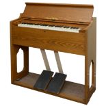 SMALL PEDAL ORGAN/HARMONIUM made by Pearl River, the organ with an oak case. 81cms high