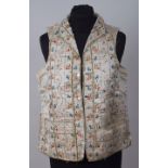 TWO C18TH GEORGIAN MEN'S WAISTCOATS To include a silk hand embroidered with colourful flowers and