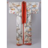 A LATE C19TH CENTURY JAPANESE WEDDING KIMONO. A damask cream silk kimono woven with flower symbols