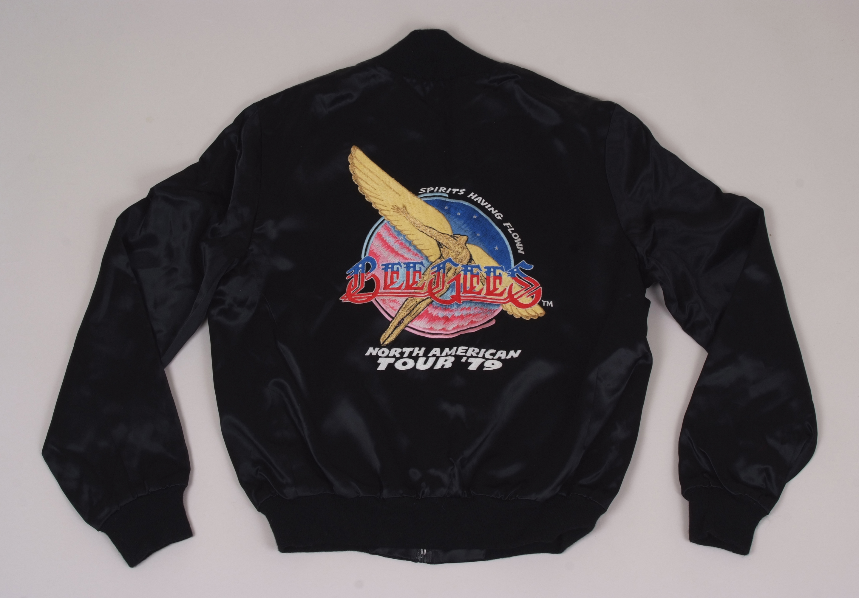 A RARE BEE GEE'S 1979 CONCERT TOUR JACKET. This black satin tour jacket was originally owned by
