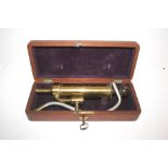 MAHOGANY CASED MEDICAL ITEM - SIMPSON an antique medical item, made in brass with a turned wooden