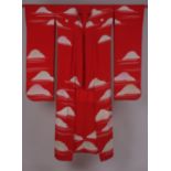 AN EARLY C20TH HEAVY SILK KIMONO A red and cream silk Japanese Kimono with clouds adorning the heavy