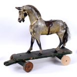 VINTAGE CHILDS PULL ALONG WOODEN HORSE a vintage painted wooden horse, fitted with a leather