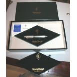 BOXED SILVER CONWAY STEWART FOUNTAIN PEN - CHURCHILL
a sterling silver fountain pen with a gold