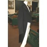 A 1930'S GENTLEMAN'S TAIL COAT Labelled 'Norton & Sons, 14 Conduit St Bond St. W.1.'  High waisted