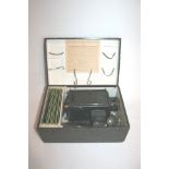 CASED MAGIC LANTERN & SLIDES a German made magic lantern with brass lens and metal chimney, also