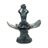 * A Neoclassical Patinated Bronze Fountainhead   cast as a merman blowing a conch horn and