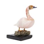 * A Carved Rose Quartz Model of a Swan   depicted standing on a pyrite base.   Height overall 3 5/