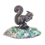 A Italian Silver Model of a Squirrel   20th Century   depicted seated on a branch eating a nut,