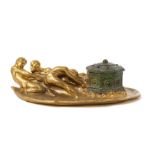 * A Tiffany Studios Jeweled Gilt Bronze Figural Inkwell   circa 1905   modeled as three men