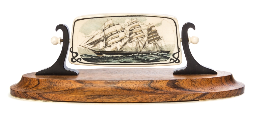 A Scrimshaw Fossil Mammoth Ivory Plaque   julius cohen   depicting a clipper ship, mounted in a